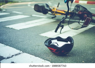 Helmet And Bike Lying On The Road On A Pedestrian Crossing, After Accident