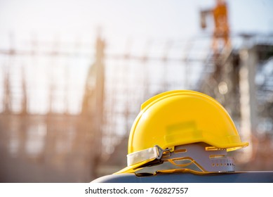helmet in construction site and construction site worker background  safety first concept