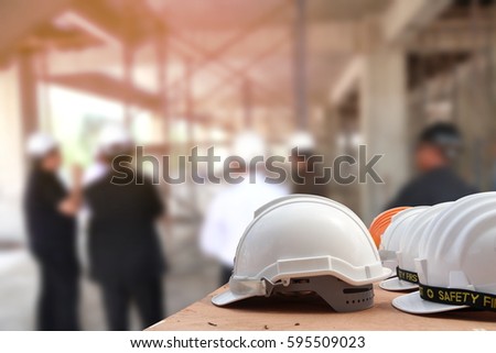 helmet for engineer security on contruction background