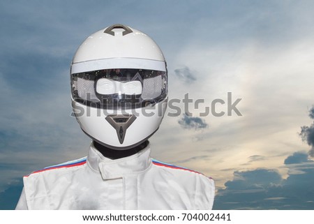 Helmet on the backdrop of a separate machine On the sky background