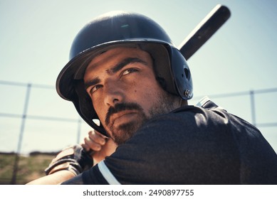 Helmet, serious and bat for sports, person and match for baseball, confident and practice of sportsman. Outdoor, athlete and professional for game, competition and man in uniform or thinking in field - Powered by Shutterstock