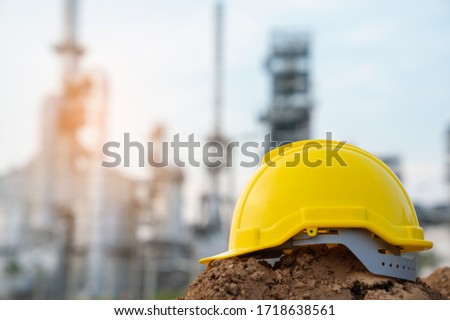 Helmet worker at refinery construction site