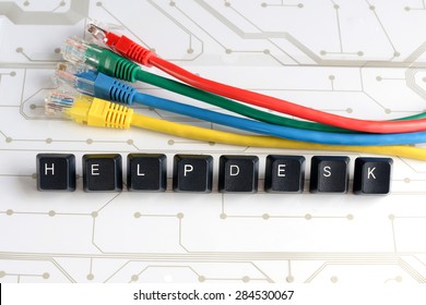 IT HELP, Assistance - HELPDESK made of keyboard keys with colourful network cables on white circuit board background