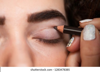 With The Help Of A Cosmetic Pencil, Paint A Thick Line On Your Cut Crease. Beauty And Makeup Concept