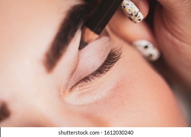 With The Help Of A Cosmetic Pencil, Paint A Thick Line On Your Cut Crease. Beauty And Makeup Concept