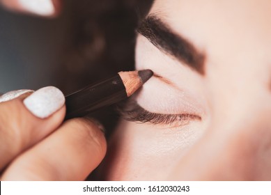 With The Help Of A Cosmetic Pencil, Paint A Thick Line On Your Cut Crease. Beauty And Makeup Concept