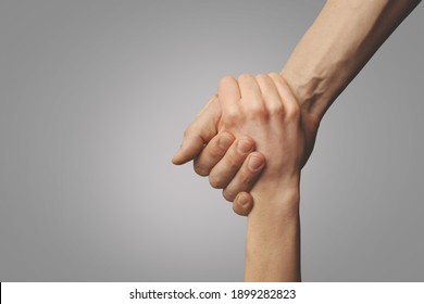 help friend through a tough time. rescue gesture. support, friendship and salvation concept. holding hands