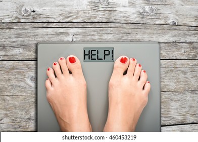 Help to lose kilograms with woman feet stepping on a weight scale