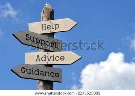 Help, support, advice, guidance - wooden signpost with four arrows, sky with clouds