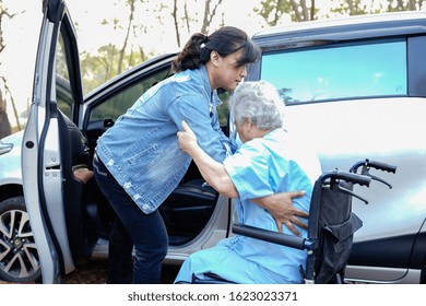 Help And Support Asian Senior Or Elderly Old Lady Woman Patient Sitting On Wheelchair Prepare Get To Her Car : Healthy Strong Medical Concept.