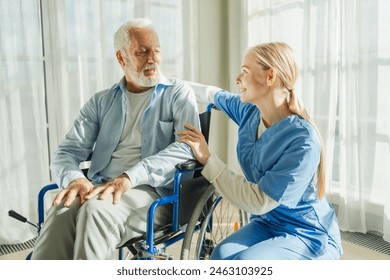 Help support retirement healthcare. Nurse helping old man in wheelchair. Patient and woman in nursing home for medical caregiver. Nurse taking care of paralyzed man in chair for people with disability