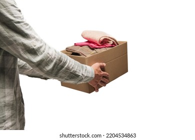 Help Those In Need. Man Holding Donation Carton Box With Goods, Warm Clothes Isolated On White Background. Program Of Help, Support To Refugees, Migrants. Social Issues, Global Problems