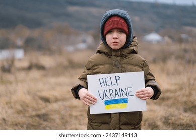 Help Ukraine. War of Russia against Ukraine. Ukrainian Crying boy asks to stop the war in Ukraine. Child with message Stop War. - Powered by Shutterstock