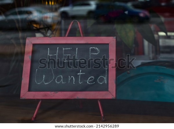 Help wanted sign in a\
restaurant