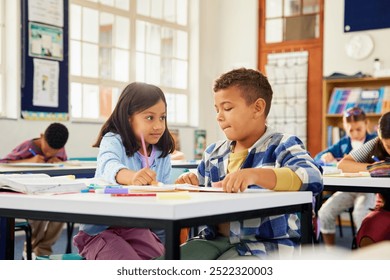 Helpful school girl assisting classmate in studies at elementary school. Two friends studying together in classroom in primary school. Middle eastern girl helping schoolboy in homework or schoolwork.  - Powered by Shutterstock