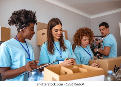 Helpful team of social workers. Group of mixed race people working in charitable foundation. Somebody's little is someone's everything. Young people sorting donations - Shutterstock ID 1786756604