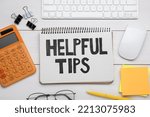 Helpful Tips. Flat lay composition with notebook, calculator and computer keyboard on white wooden table
