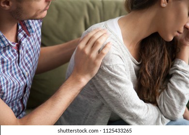 Helping Caring Husband Apologizing Comforting Wife, Understanding Man Expressing Sympathy Encouraging Upset Woman, Apology And Forgiveness, Support In Marriage Concept, Hand On Shoulder Close Up View