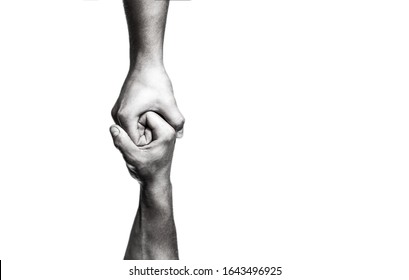 Helping hand concept and international day of peace, support. Helping hand outstretched, isolated arm, salvation. Close up help hand. Two hands, helping arm of a friend, teamwork. Black and white. - Shutterstock ID 1643496925