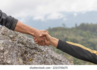 Helping hand concept and international day of peace.Lending a helping hand. People helping each other concept. - Shutterstock ID 2215745675