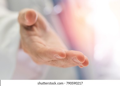 Helping Hand Doctor Medical Healthcare Specialized Assistance Concept. Hand Of Physician In Hospital Offering Support Service For Patient. 