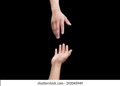 helping hand and hands praying on black background, victim of holocaust concept