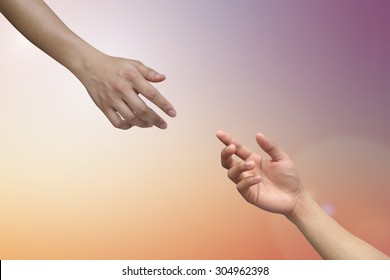 helping hand and hands praying on blurred colorful background , helping hand concept.