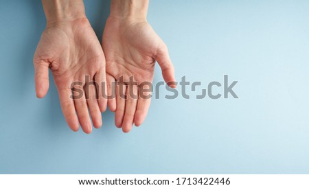 Helping hand, open palm, support in difficult situation, crisis. Last chance, hope concept. Two palms on blue background. Psychological service. Long banner