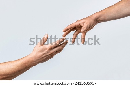 Helping hand outstretched, isolated arm, salvation. Close up help hand. Two hands, helping arm friend, teamwork. Helping hand concept and international day of peace, support.