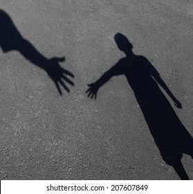 Helping Hand With A Shadow Of An Adult Hand Offering Help Or Therapy To A Child In Need As An Education Concept Of Charity Towards Needy Kids And Teacher Guidance To Students Who Need Tutoring.