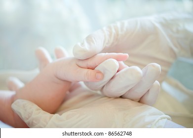 A Helping Hand To Sick Baby In Hospital