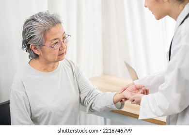 Helping Hands, Care For The Elderly Concept. Doctor Use Hand Screening Vital Sign Of Old Asian Patient. Doctor Checking Patient's Pulse - Medical Concept.