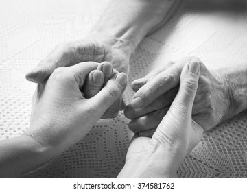 Helping Hands, Care For The Elderly Concept, Man's Hands Black And White
,