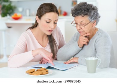 Helping Her Grandma Do A Crossword