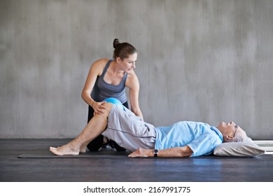 Helping Her Patients Stay Strong And Healthy. Shot Of A A Physical Therapist Working With A Senior Man.