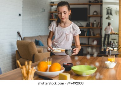 Helping Mother To Set Up A Table