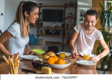 Helping Mother To Set Up A Table