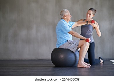 Helping Patients Stay Strong And Healthy. Shot Of A A Physical Therapist Working With A Senior Man.