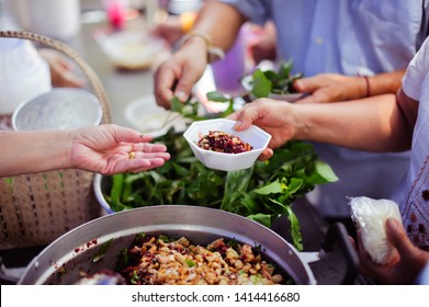 Helping People With Hunger With Kindness : the concept of life problems, hunger in society : concept of charity food for the poor : Hand-feeding to the needy in society - Shutterstock ID 1414416680