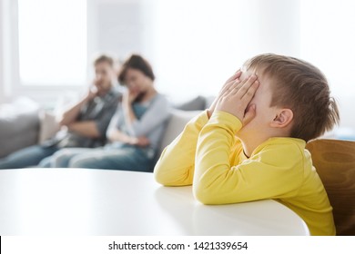 Helpless Parents And Their Badly Behaving Son At Home