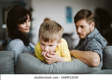 Helpless Parents And Their Badly Behaving Son At Home