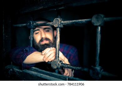 Helpless Prisoner Between Bars Stock Photo (Edit Now) 784111894