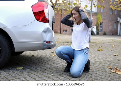 Helpless Woman Looking At Her Damaged Car