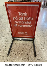 Helsingborg, Sverige - April 7 2020: A Sign Holder With A Text That Encourages Customers To Keep Distance With Each Other And To Act And Shop With Consideration. Due To The Corona Virus, Covid-19.