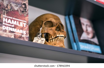 HELSINGOR, DENMARK-FEBRUARY 16, 2012: Skull And Crossbones, And Books For Sale, At The Tourist Shop Of The Knonborg Castle, Where William Shakespeare Based His Hamlet Drama Novel.