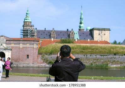 HELSINGOR, DENMARK-FEBRUARY 16, 2012: Tourist Take A Photo To The Knonborg Castle, Where William Shakespeare Based His Hamlet Drama Novel.