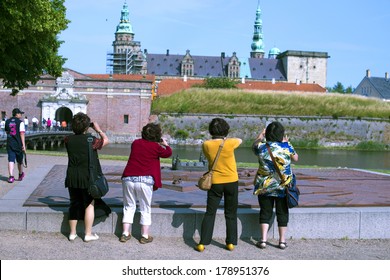 HELSINGOR, DENMARK-FEBRUARY 16, 2012: Tourists Take A Photo To The Knonborg Castle, Where William Shakespeare Based His Hamlet Drama Novel.