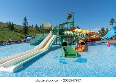 Helsinki, Finland- 07.04.2021: Serena Water Amusement Park. Fun Family Holiday Location In Scandinavia. Close Up Image Of Outdoor Water Slides In The Park. Sunny Weather And Perfect Holiday Season