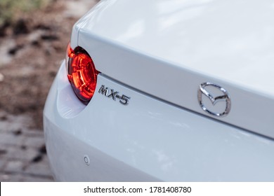 Helsinki, Finland 19 July 2020 Mazda MX-5 cabrio is the fourth and current generation of the Mazda MX-5. White Mazda Roadster rear view to Mazda logotype and label MX-5