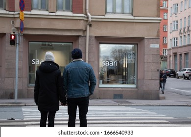 Helsinki, Finland - 3 March 2020: Couple Crossing Street , Illustrative Editorial